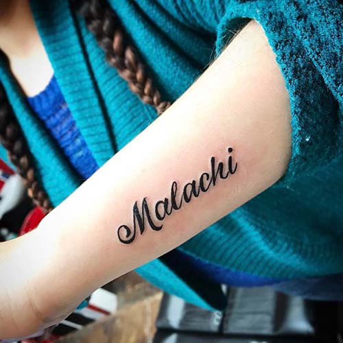 woman forearm name tattoo