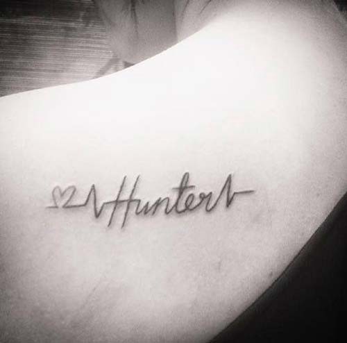 shoulder back name tattoo with heart