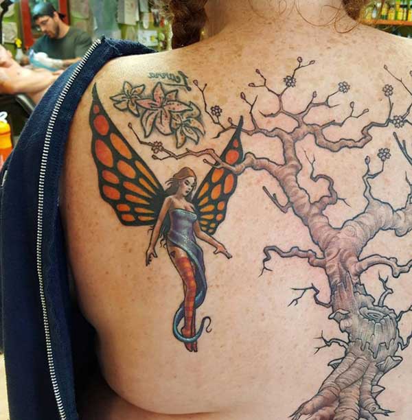 angel and tree tattoo