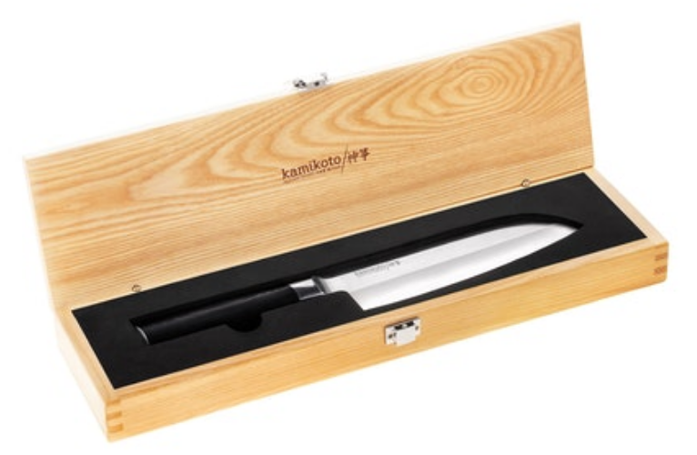 A sharp handmade kitchen knife in its wooden box