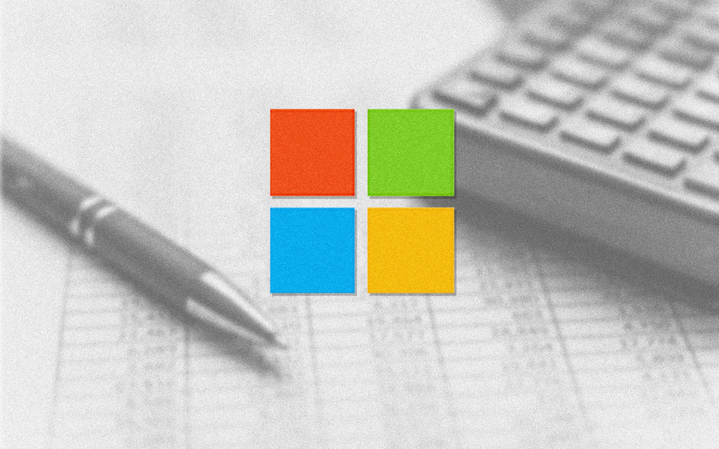 Microsoft logo over an image of a calculator, pen, and printed table chart.