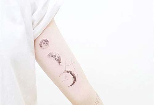 upper arm moon tattoos bicep moon tattoos