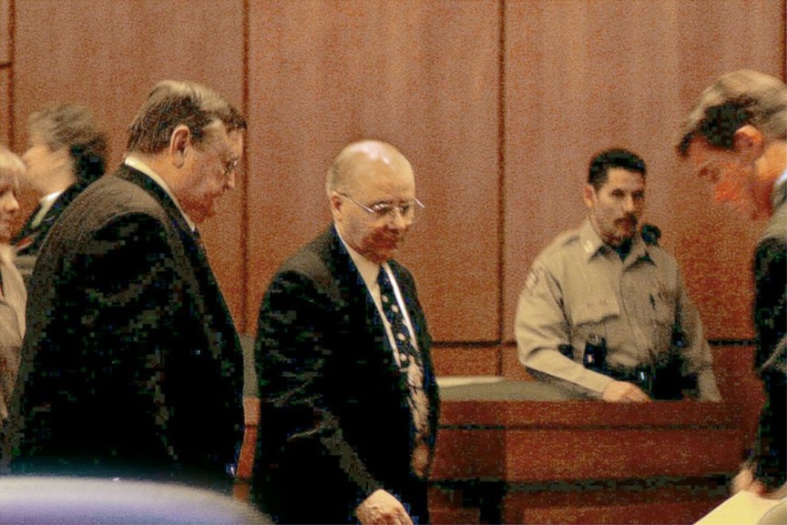 On October 13, 2003, John Edward Robinson, Sr. enters the courtroom in Harrisonville, Missouri.