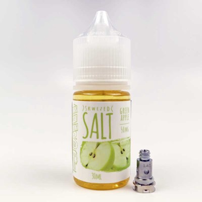 A bottle of Skwezed Green Apple nicotine salt juice next to a 1.4 ohm nord coil.