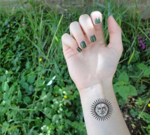 lady wrist sun tattoo woman wrist sun tattoo