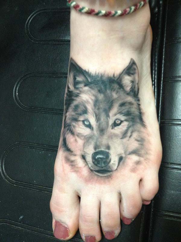 foot tattoo wolf