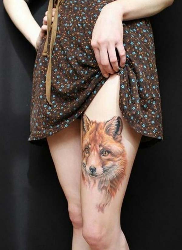 upper leg wolf tattoo