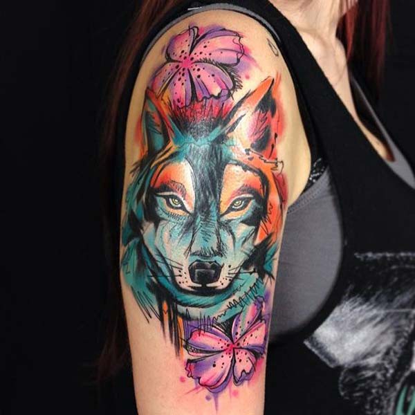 upper arm wolf tattoo female model