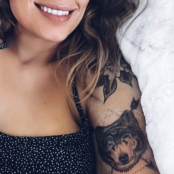 beautiful woman with wolf tattoo