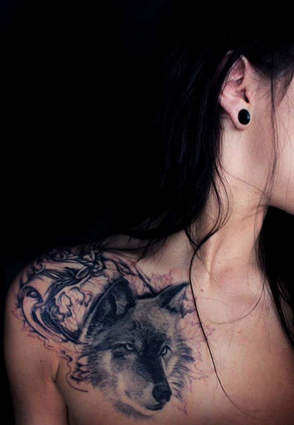 woman shoulder wolf tattoo