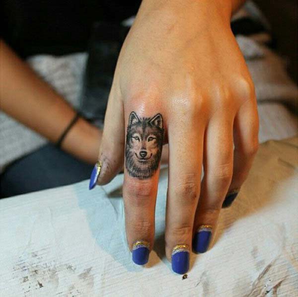 finger tattoo wolf