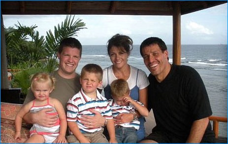 Russell Brunson with his children, wife and tony robbins